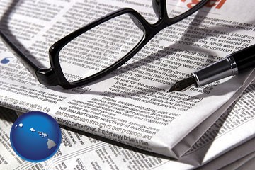 a newspaper, with reading glasses and fountain pen - with Hawaii icon