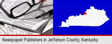 a newspaper, with reading glasses and fountain pen; Jefferson County highlighted in red on a map