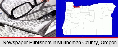 a newspaper, with reading glasses and fountain pen; Multnomah County highlighted in red on a map