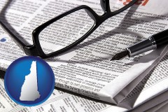 new-hampshire map icon and a newspaper, with reading glasses and fountain pen
