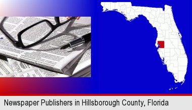 a newspaper, with reading glasses and fountain pen; Hillsborough County highlighted in red on a map